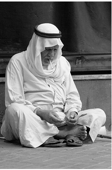 Old man smoking in the capital.