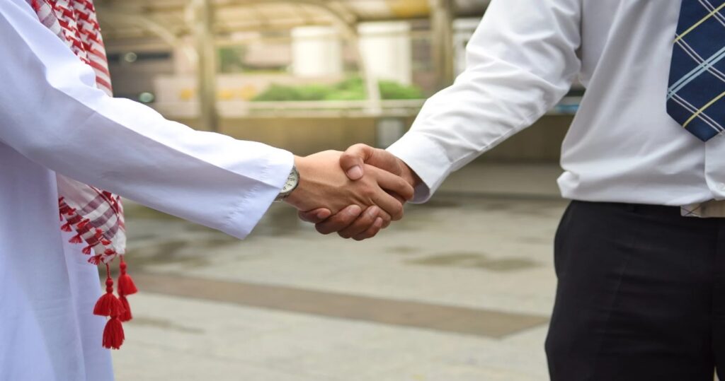 Handshake between Arab and a Businessman